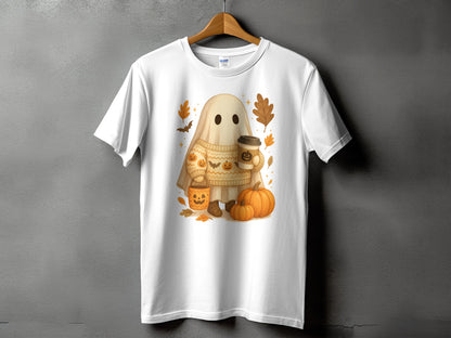 White t-shirt featuring a cute ghost holding coffee and pumpkins with fall leaves.
