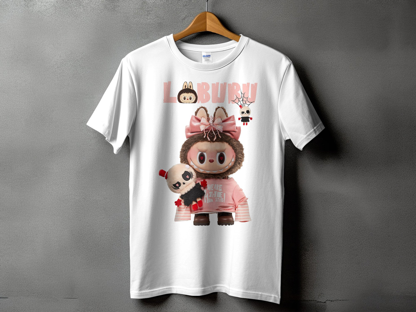White t-shirt with graphic of character, panda, and text "LABURU".