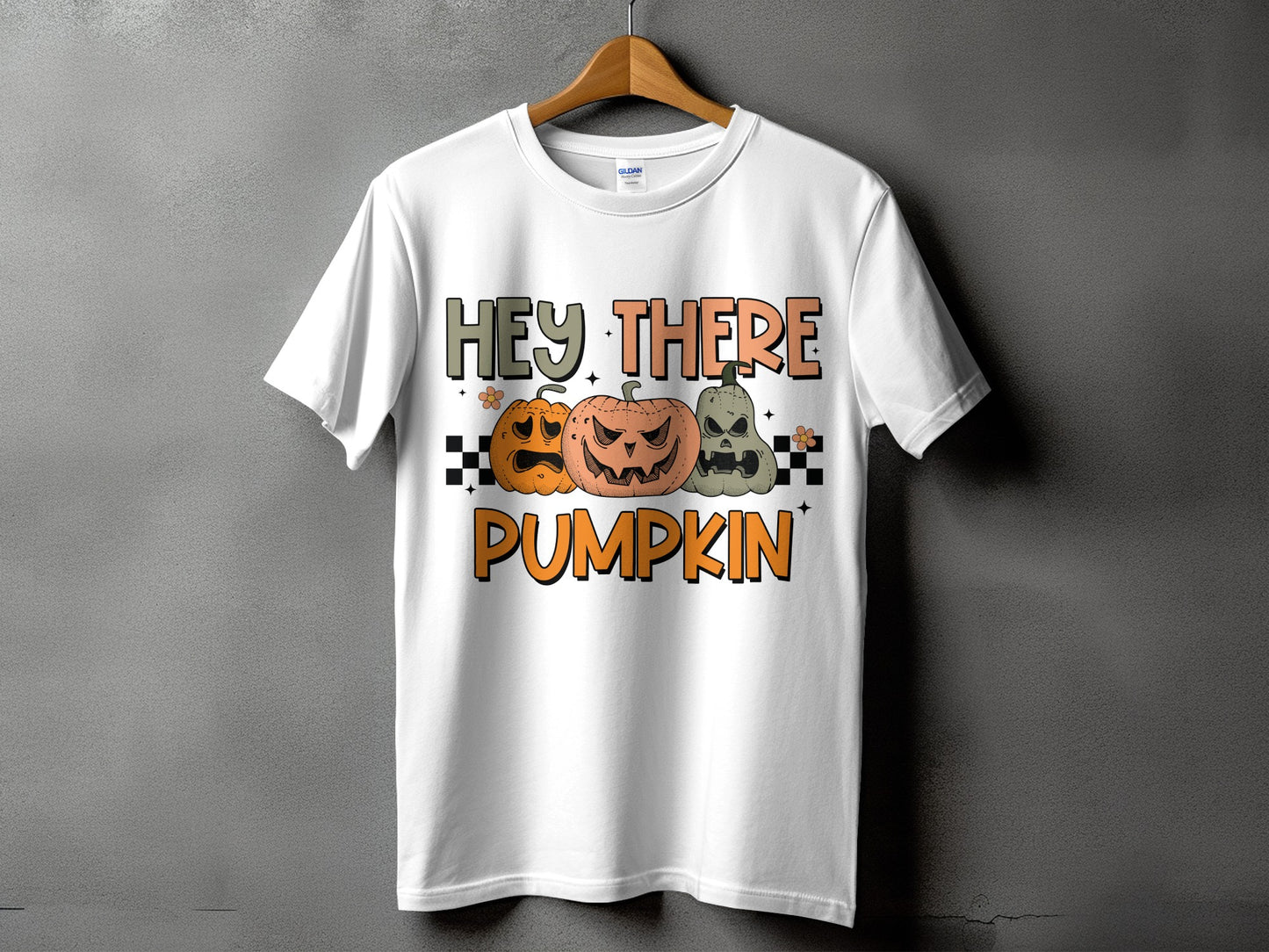 White t-shirt with "Hey There Pumpkin" text and three jack-o'-lanterns.