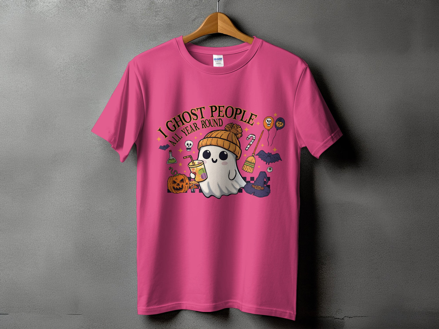 Pink t-shirt with "I Ghost People All Year Round" Halloween graphic.