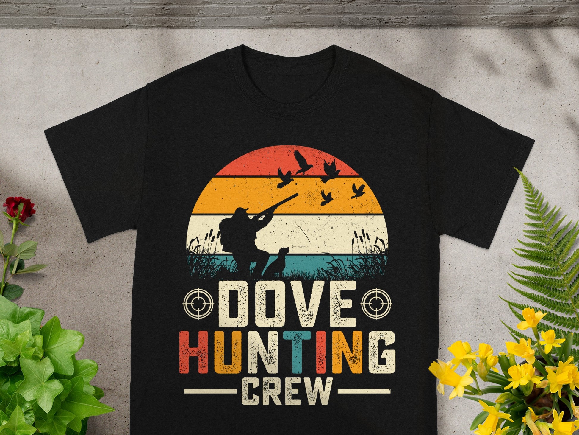 Black t-shirt with vintage sunrise graphic and text "DOVE HUNTING CREW".