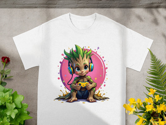 Groot wearing headphones holds a video game controller, sitting on a white t-shirt.