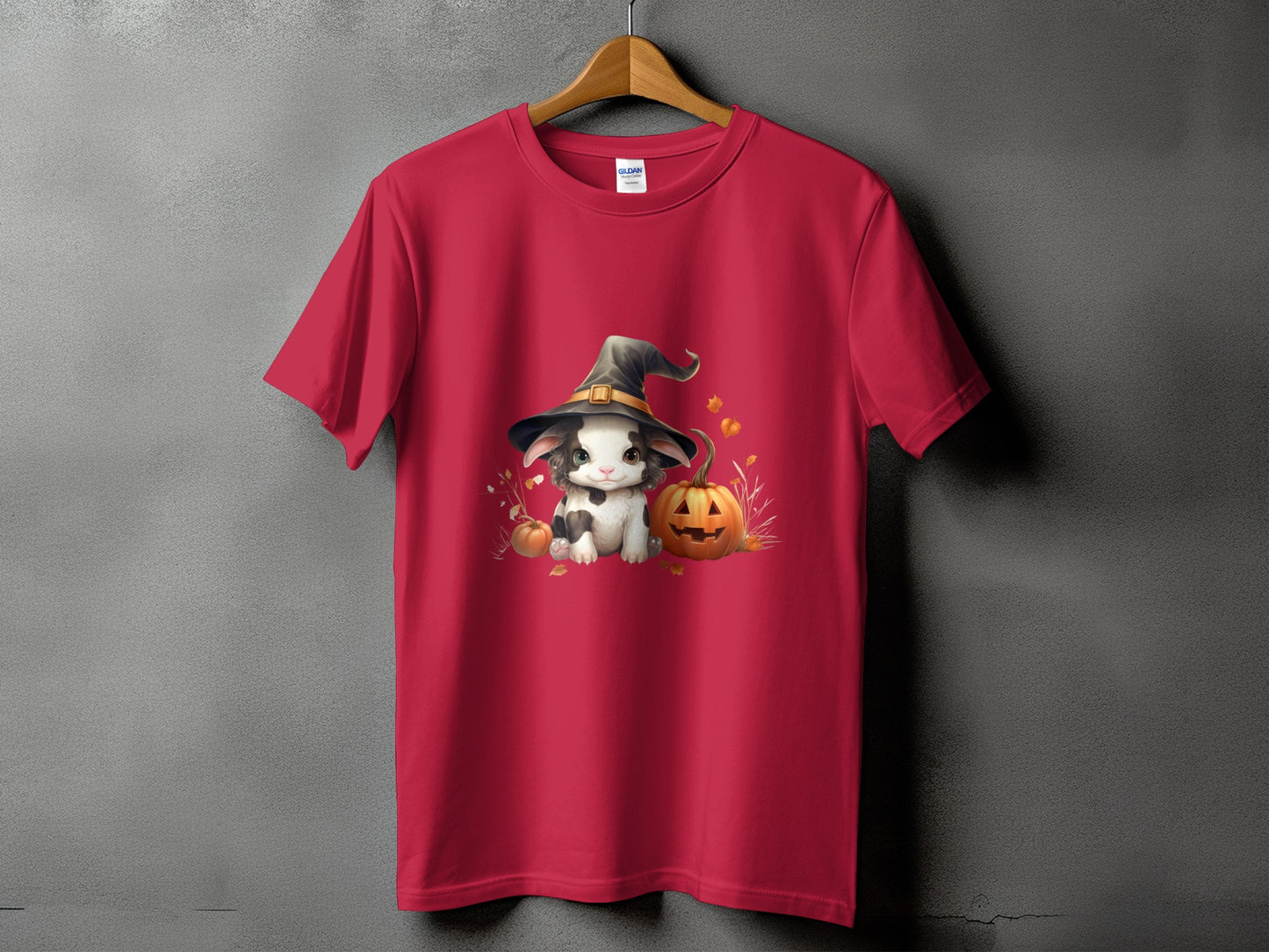 Red t-shirt with a Halloween graphic of a bunny in a witch hat with pumpkins.