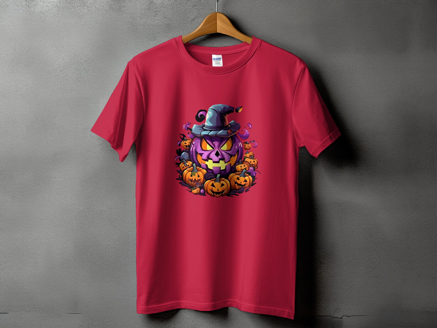 Red t-shirt with a Halloween pumpkin graphic wearing a witch hat.