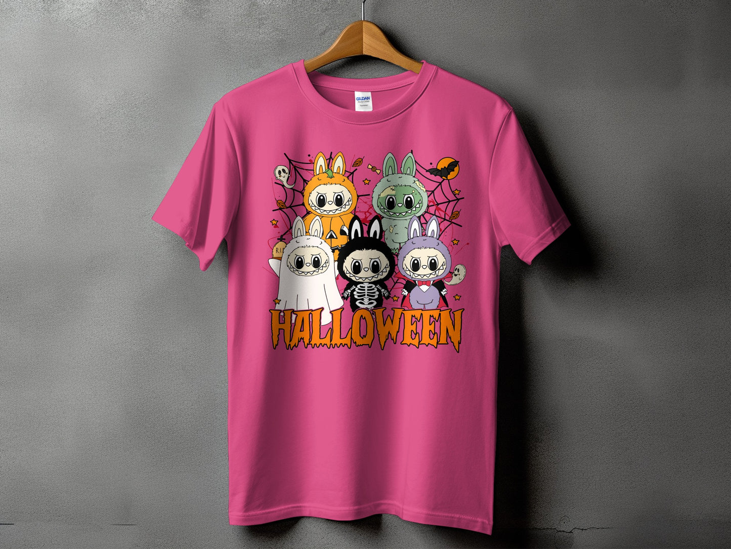 Pink t-shirt with cartoon Halloween characters and "HALLOWEEN" text.