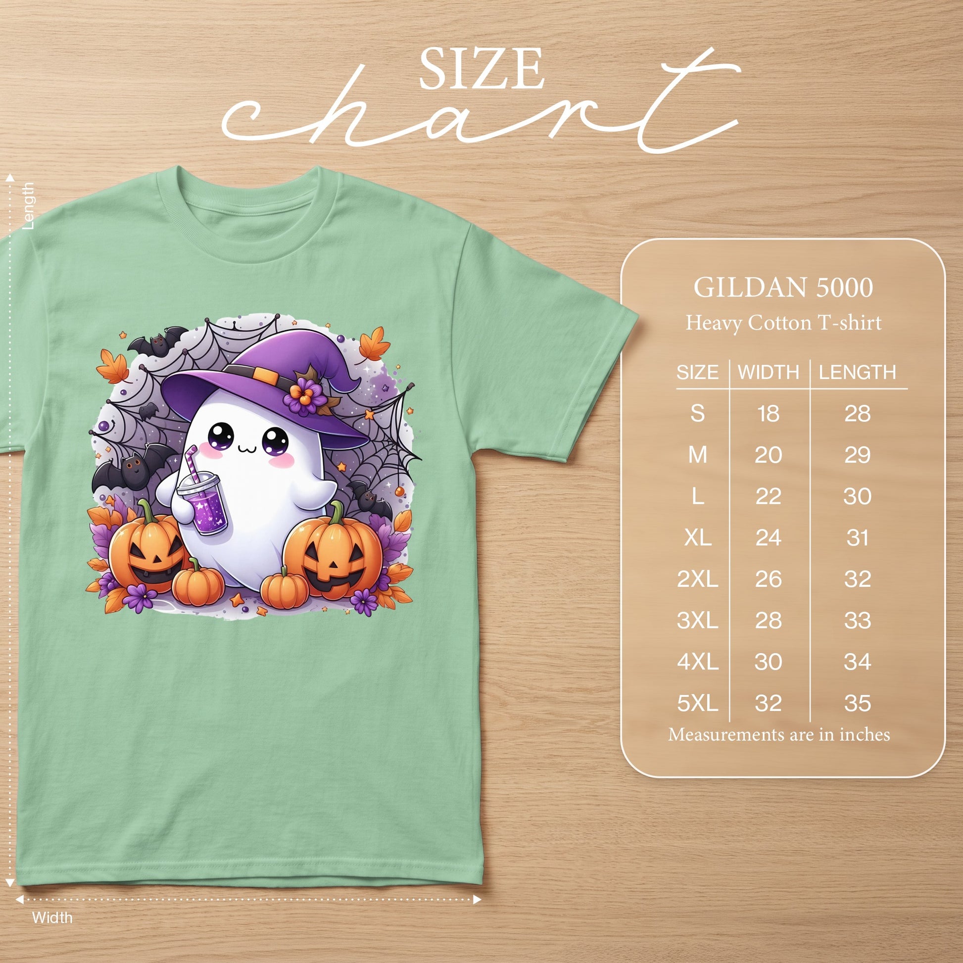 Light green Gildan 5000 t-shirt with a cute ghost, pumpkins, bats, and spiderwebs graphic.