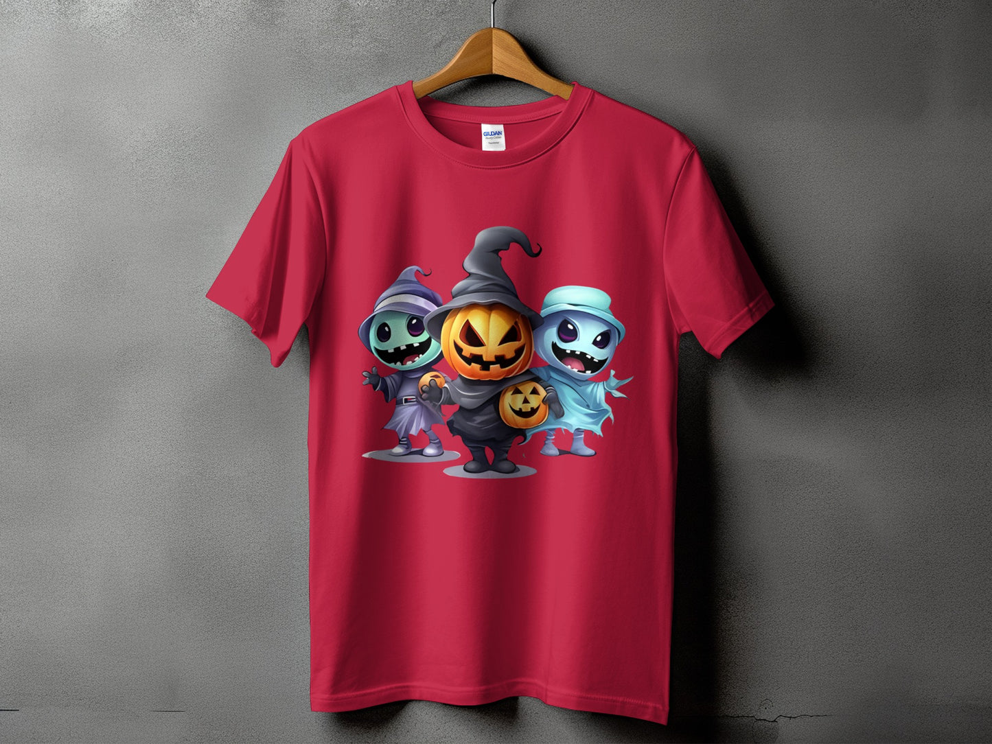 Red t-shirt with a graphic of three cartoon Halloween characters including a pumpkin.