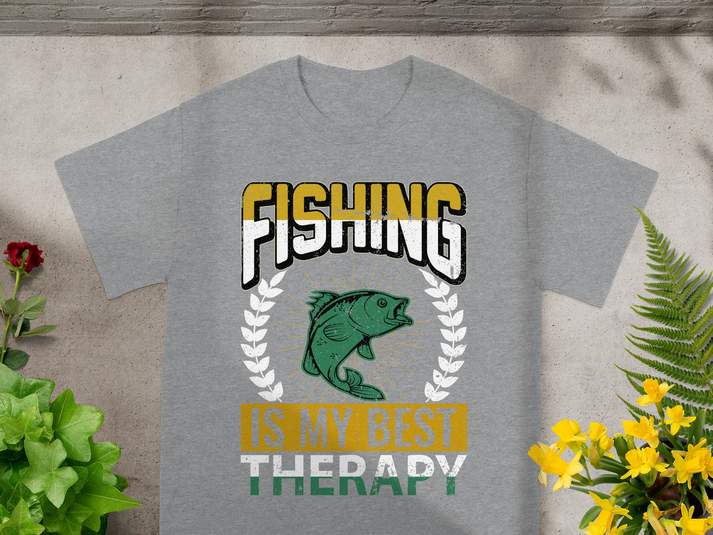 Grey t-shirt with text "FISHING IS MY BEST THERAPY" and a green fish graphic.