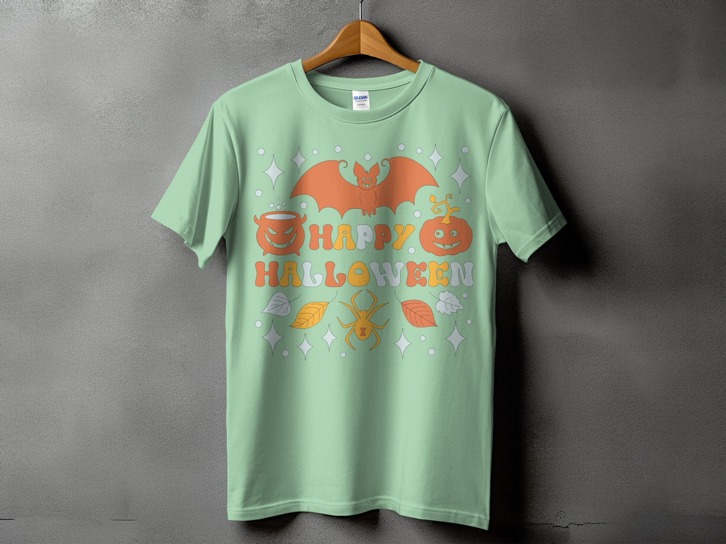 Green t-shirt with a retro "Happy Halloween" design featuring a bat, pumpkin, and spider.