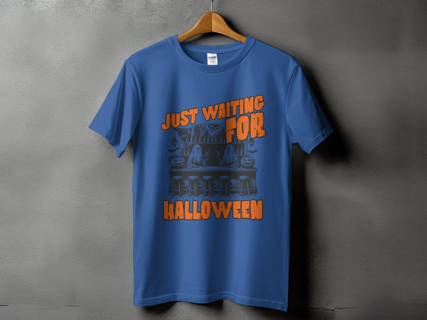 Blue t-shirt with orange text and Halloween graphic of ghosts at a bar.
