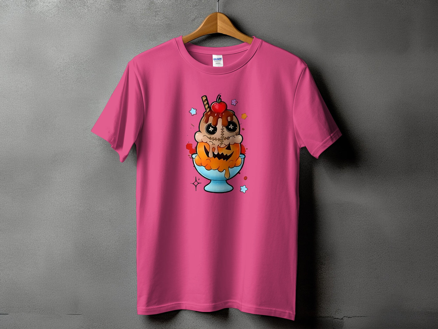 Pink t-shirt featuring a cartoon ice cream sundae with a pumpkin face and stitched details.