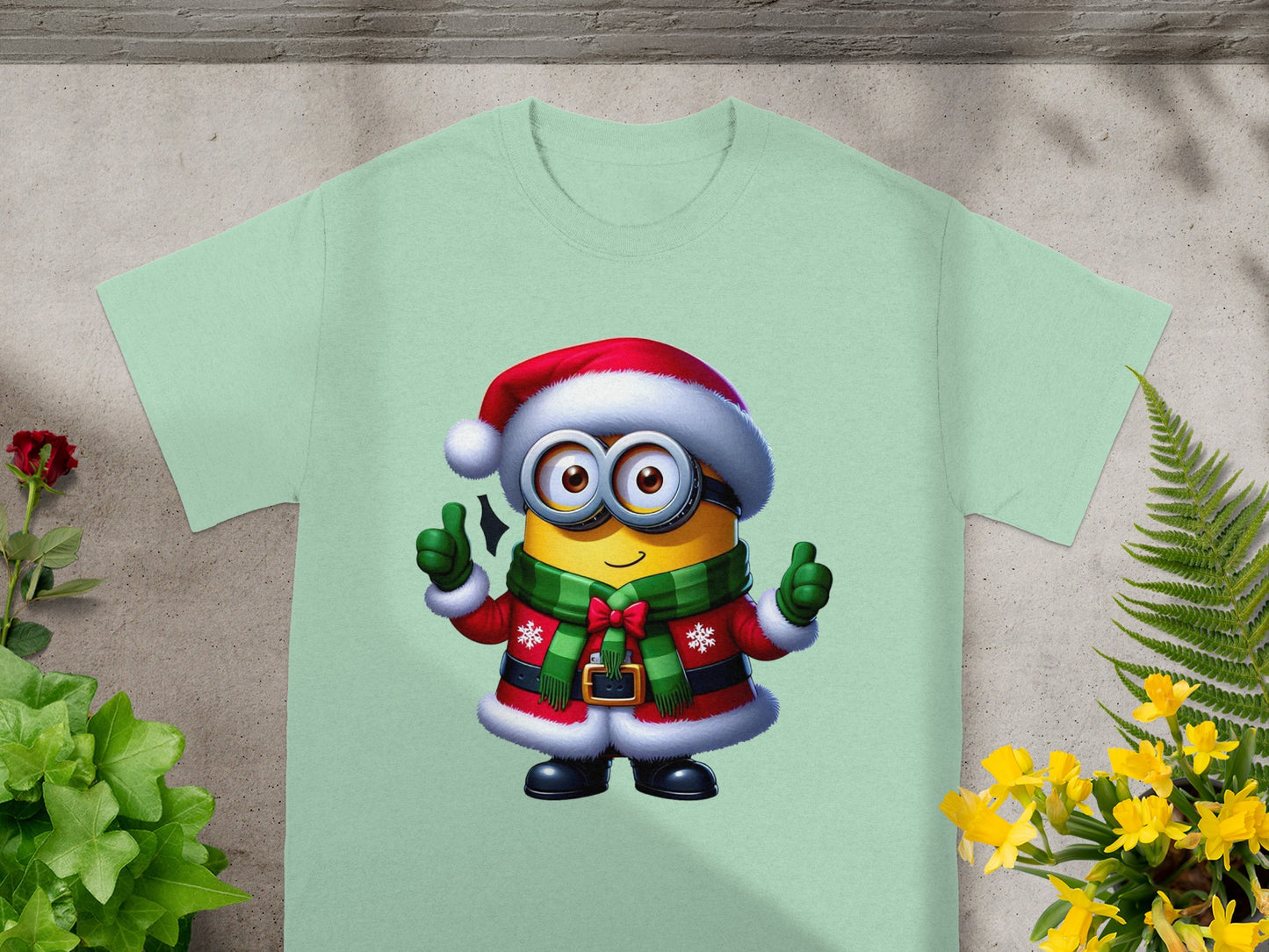 Minion character in Santa hat and Christmas outfit giving two thumbs up.