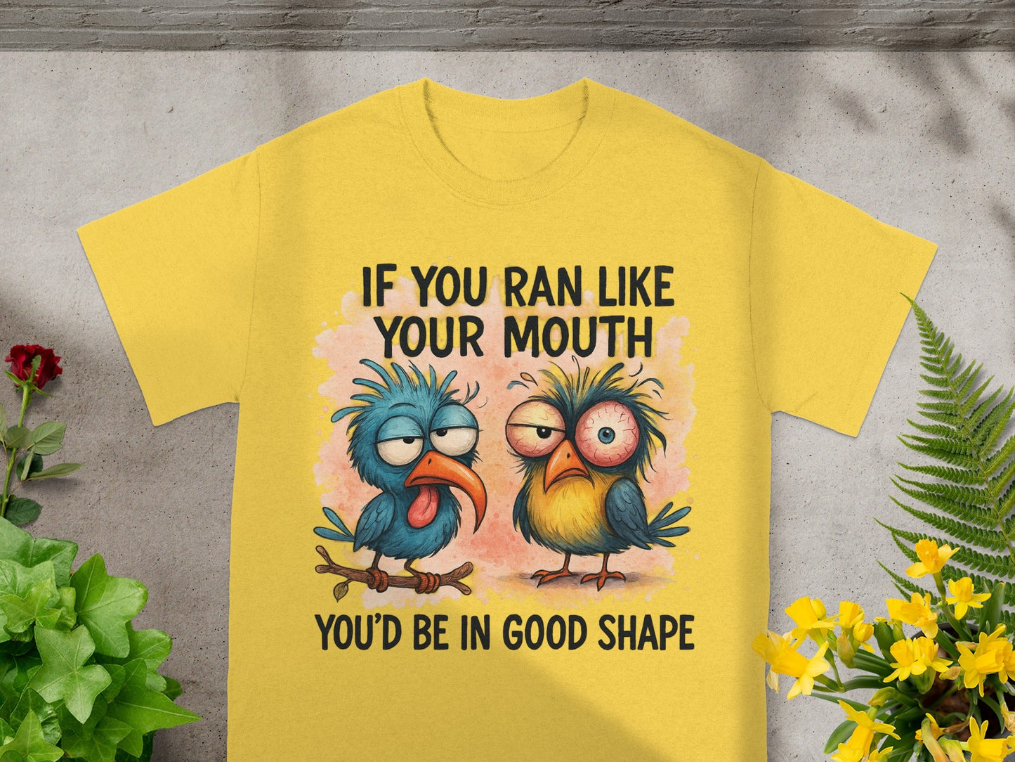 Yellow t-shirt with cartoon birds and text: "IF YOU RAN LIKE YOUR MOUTH, YOU'D BE IN GOOD SHAPE."