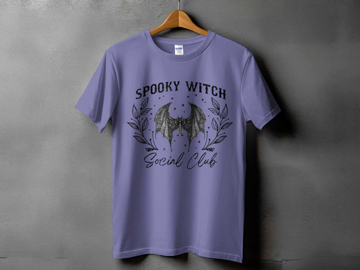 Purple t-shirt with "Spooky Witch Social Club" text and bat graphic.