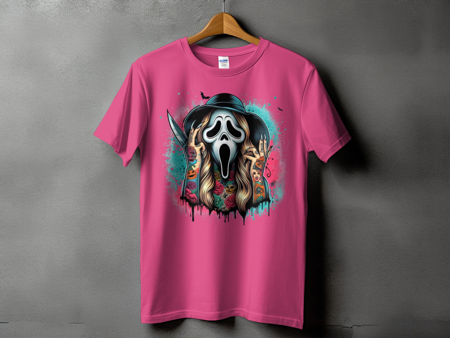 Pink t-shirt with a graphic of a skull mask wearing a hat and holding a knife.