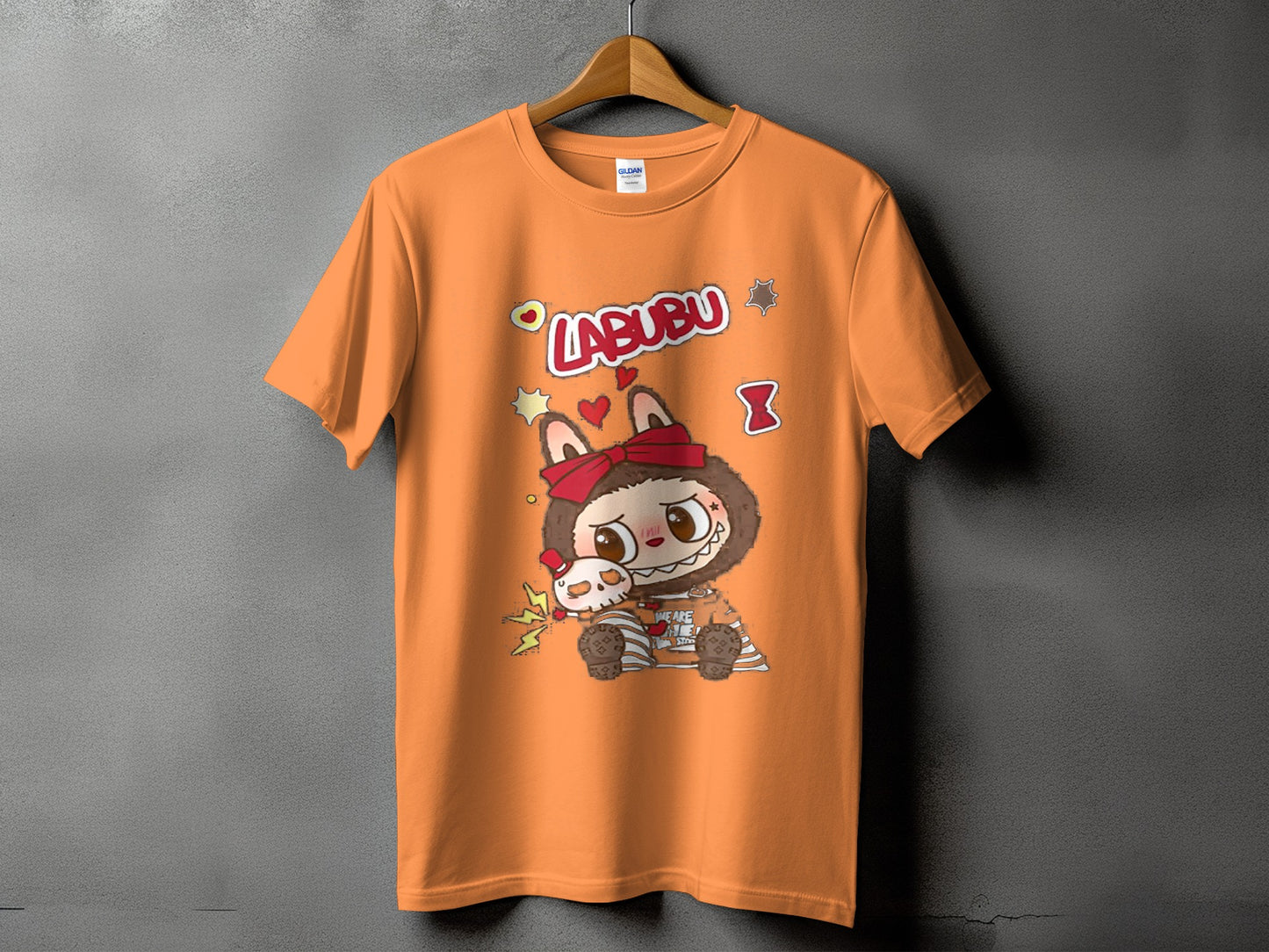Orange t-shirt with "LABUBU" text and character graphic featuring a large-eyed monster and a skull.