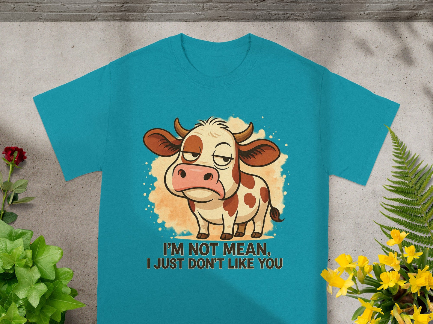 Teal t-shirt with a cartoon cow and text "I'm not mean, I just don't like you."