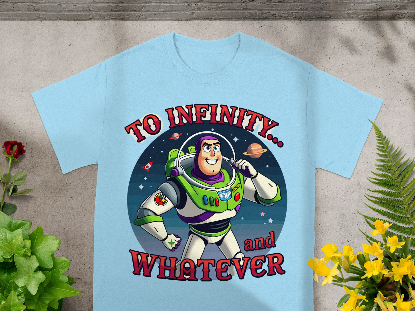 Light blue t-shirt graphic featuring Buzz Lightyear with "TO INFINITY... and WHATEVER".