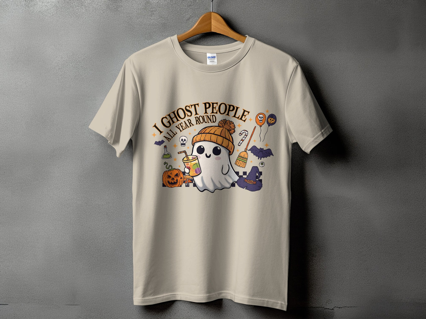 Light tan t-shirt with a ghost design saying "I ghost people all year round."