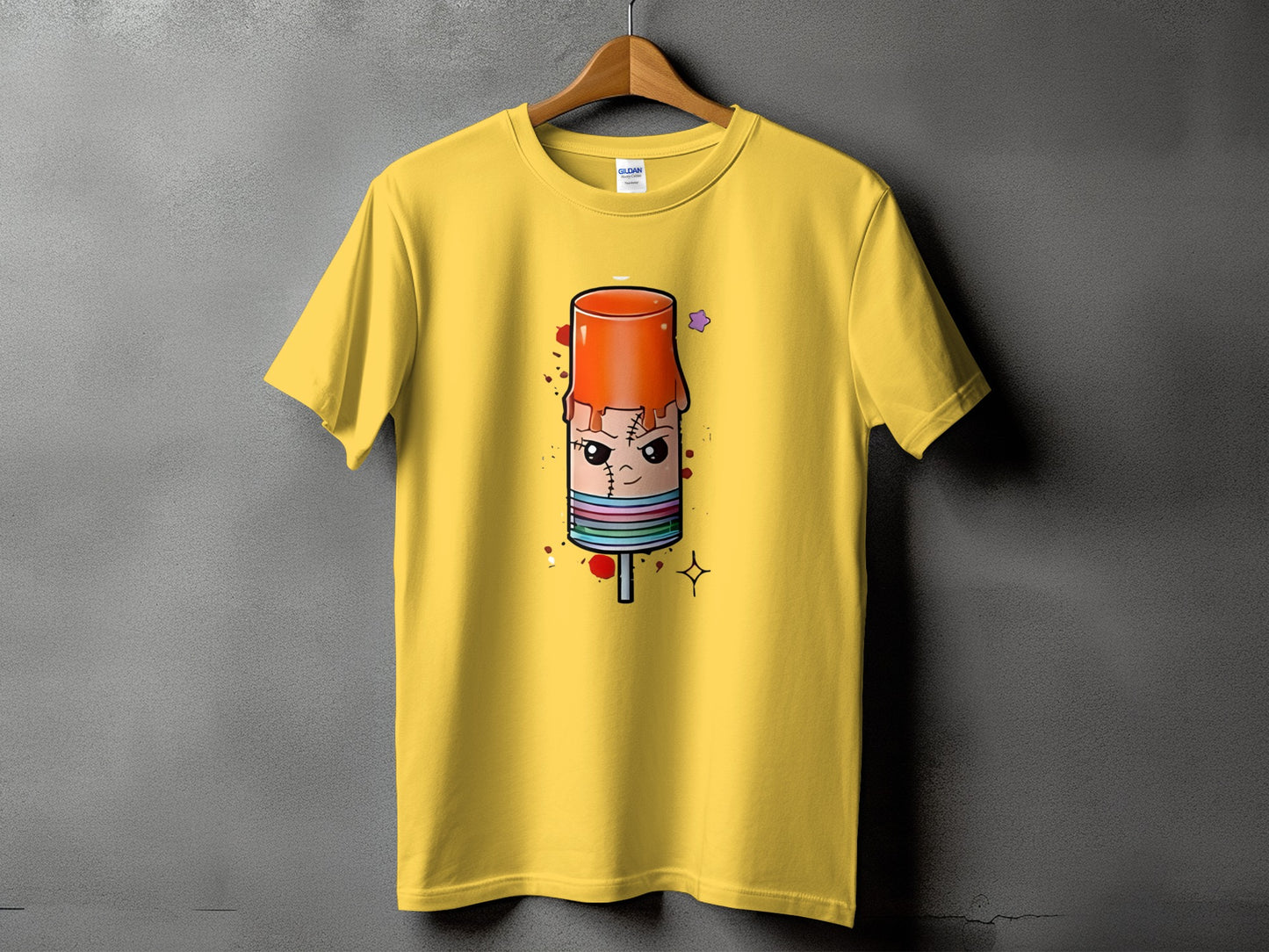 Yellow t-shirt with a cartoon popsicle design featuring stitches and a grumpy face.
