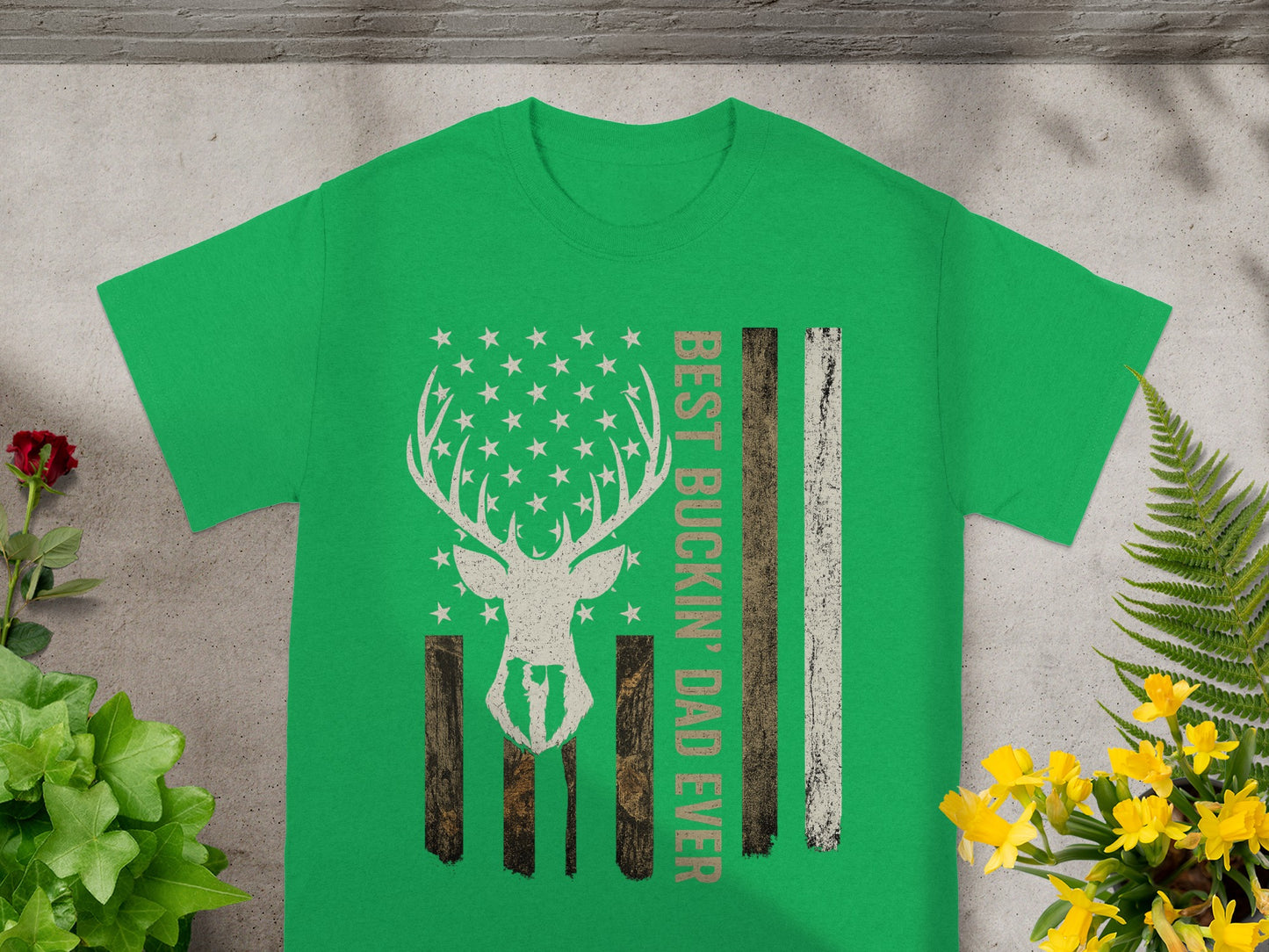 Green t-shirt with distressed deer head American flag graphic and text.