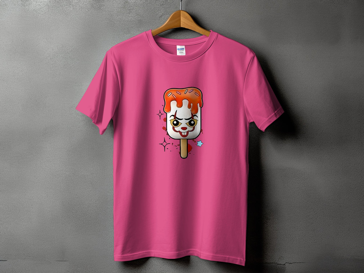 Pink t-shirt with a creepy clown popsicle graphic.
