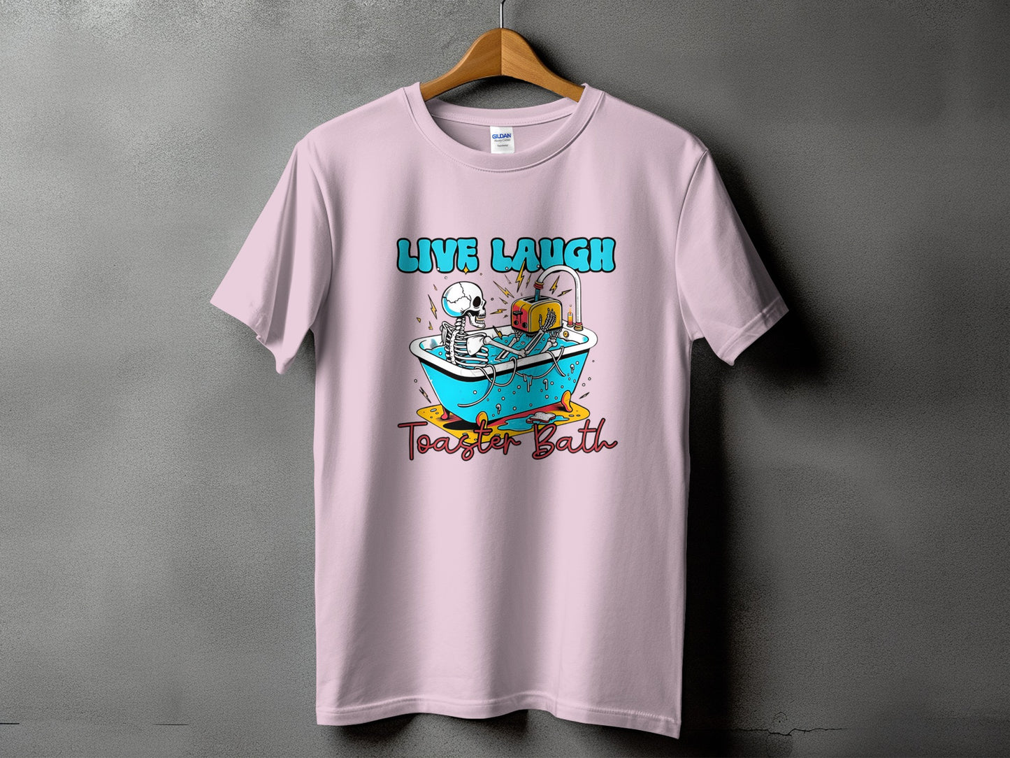Pink t-shirt with "Live Laugh Toaster Bath" text and skeleton in a bathtub.