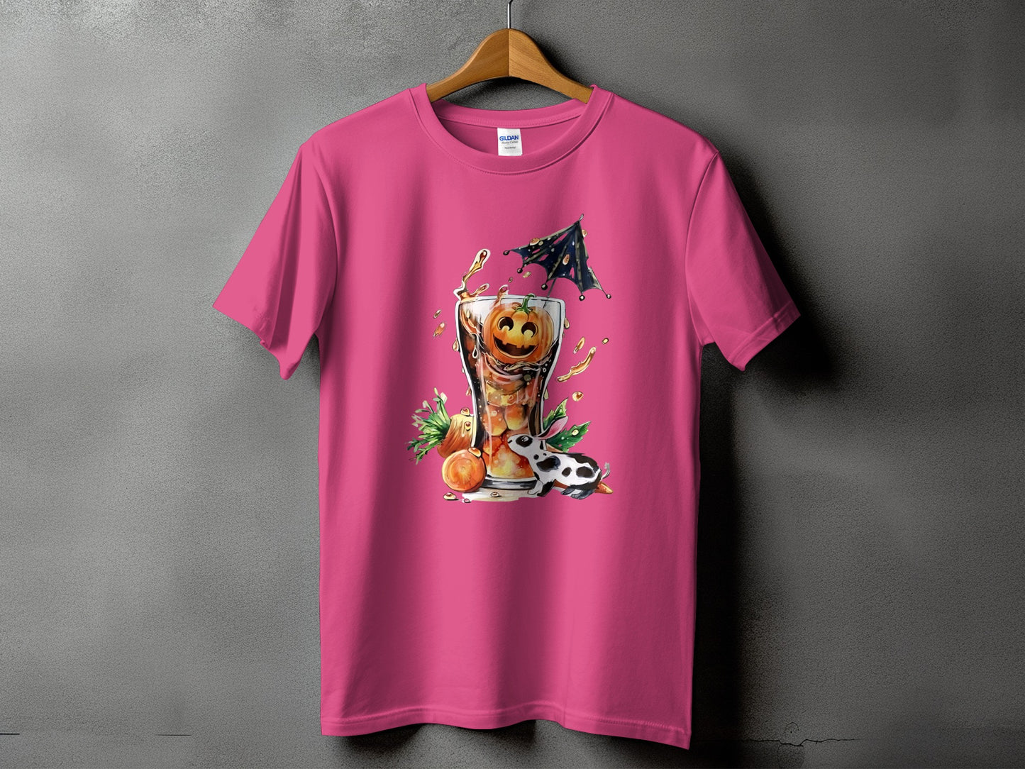 Pink t-shirt with Halloween graphic of a pumpkin cocktail and a cow.