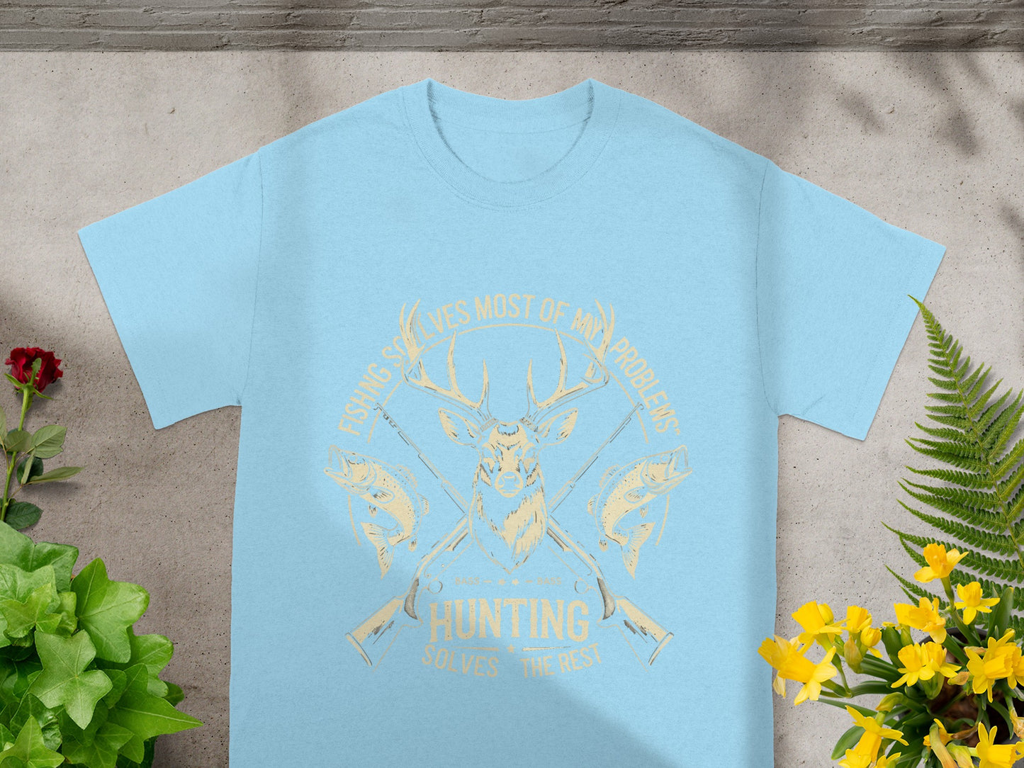 Light blue t-shirt with deer, fish, and guns graphic reading "Fishing Solves Most of My Problems, Hunting Solves the Rest."