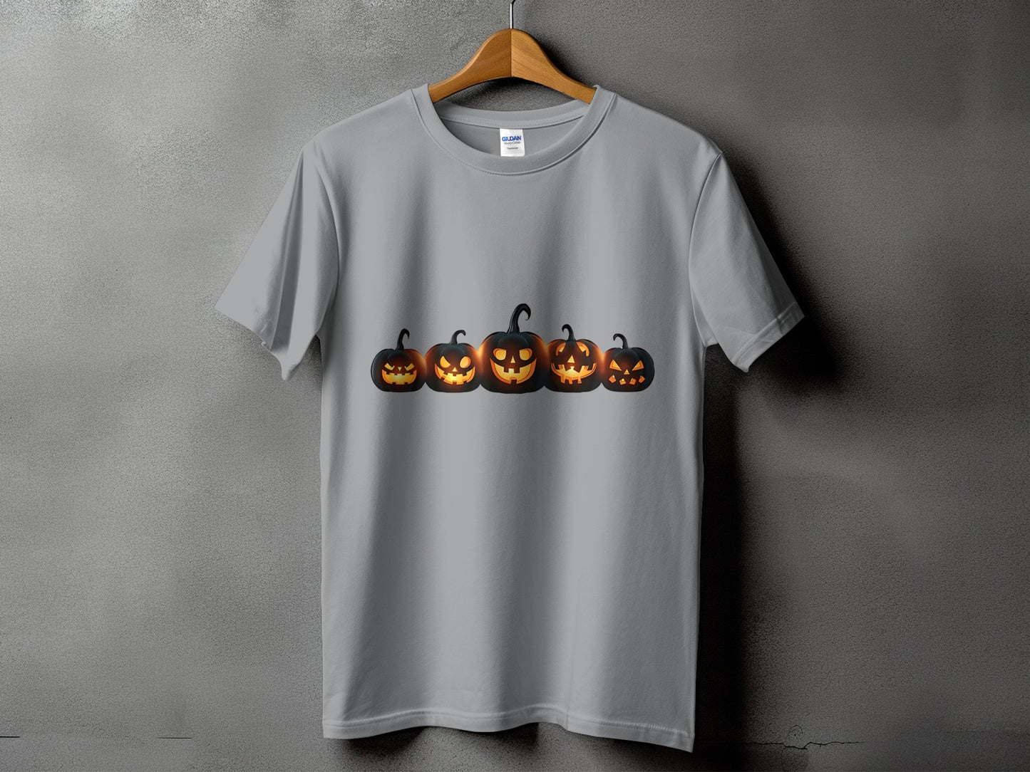 Gray t-shirt featuring a row of five glowing Jack-o'-lanterns.