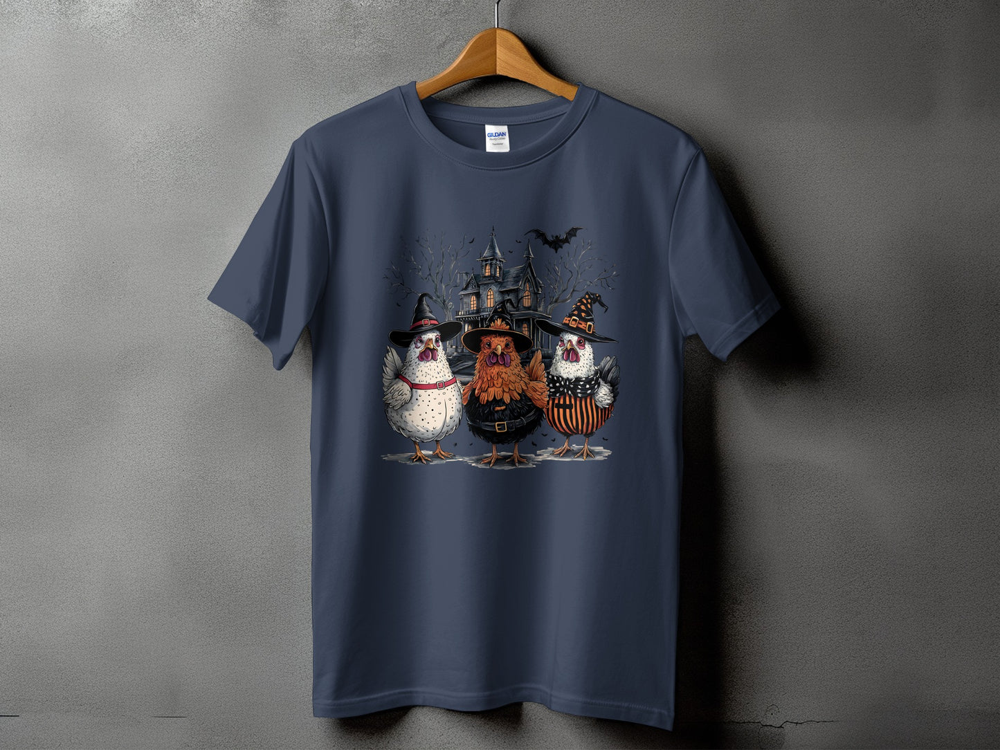 Three chickens in witch hats stand before a spooky haunted house.
