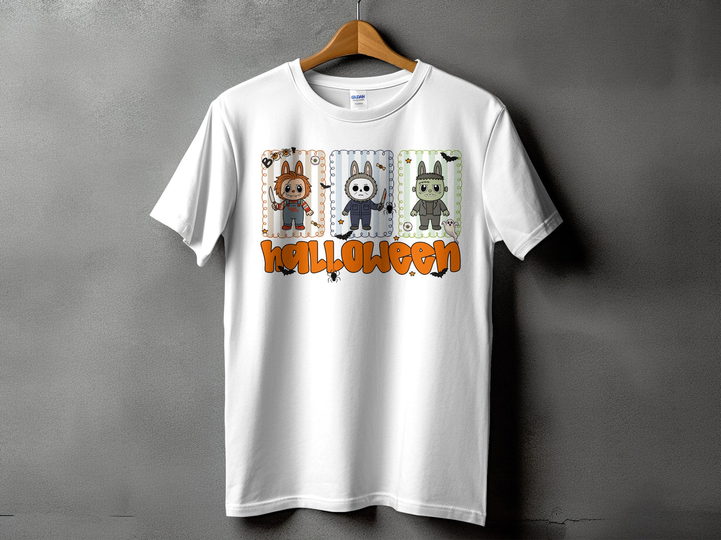 White t-shirt with cartoon Halloween characters and "halloween" text design.