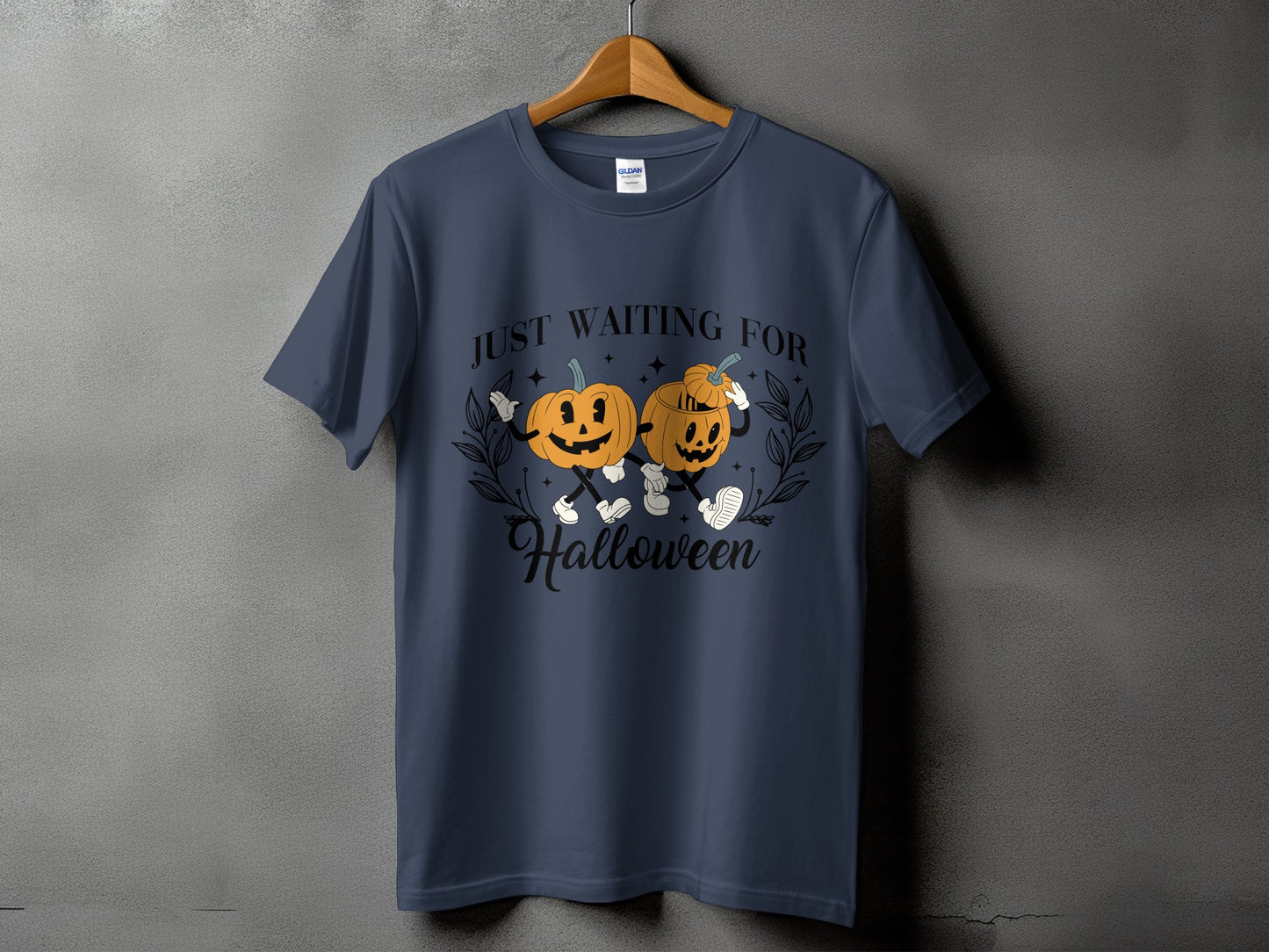 Dark blue t-shirt with two cartoon pumpkins saying "Just Waiting For Halloween".