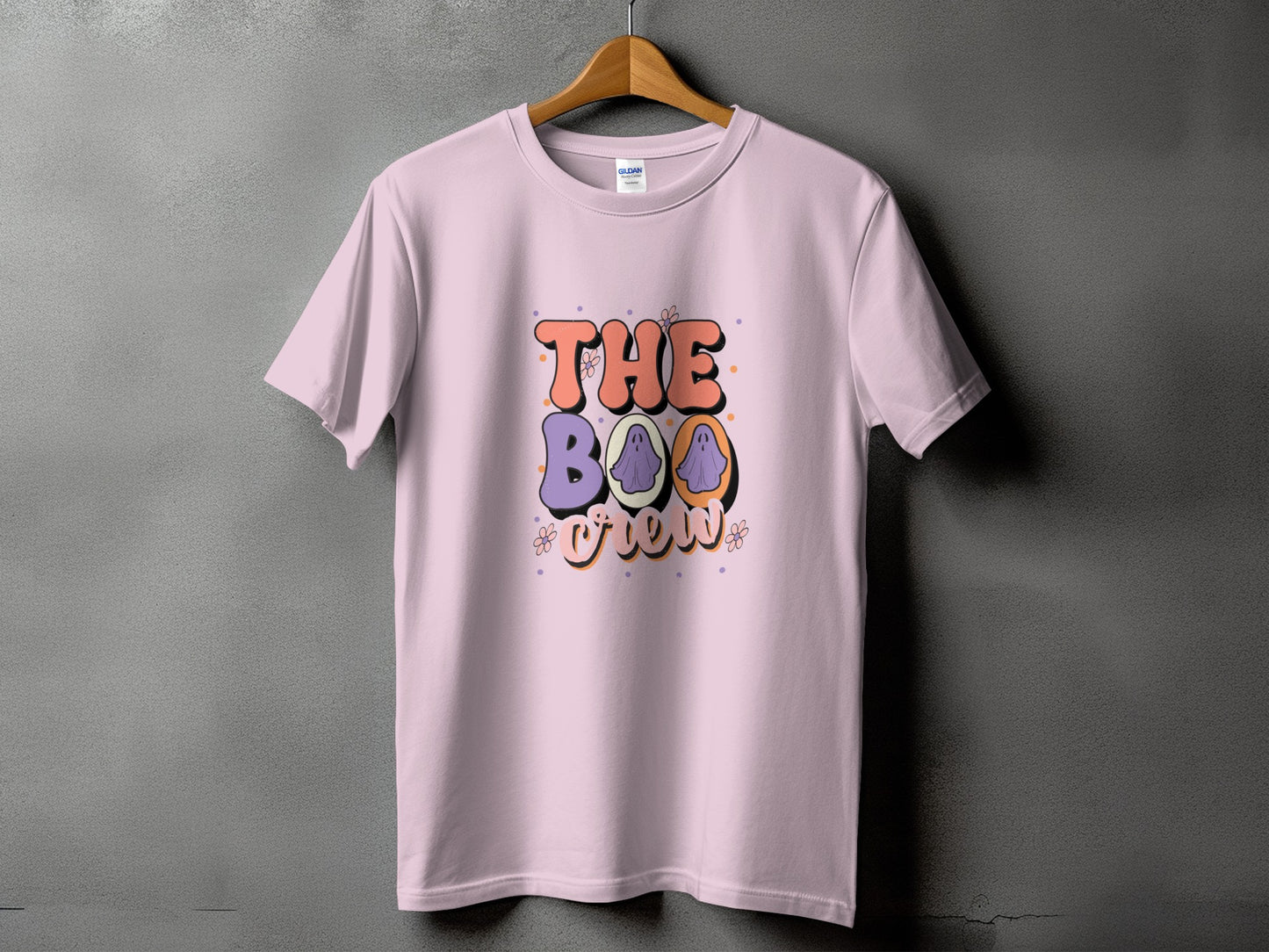 Pink t-shirt with "The Boo Crew" text and ghost graphics.