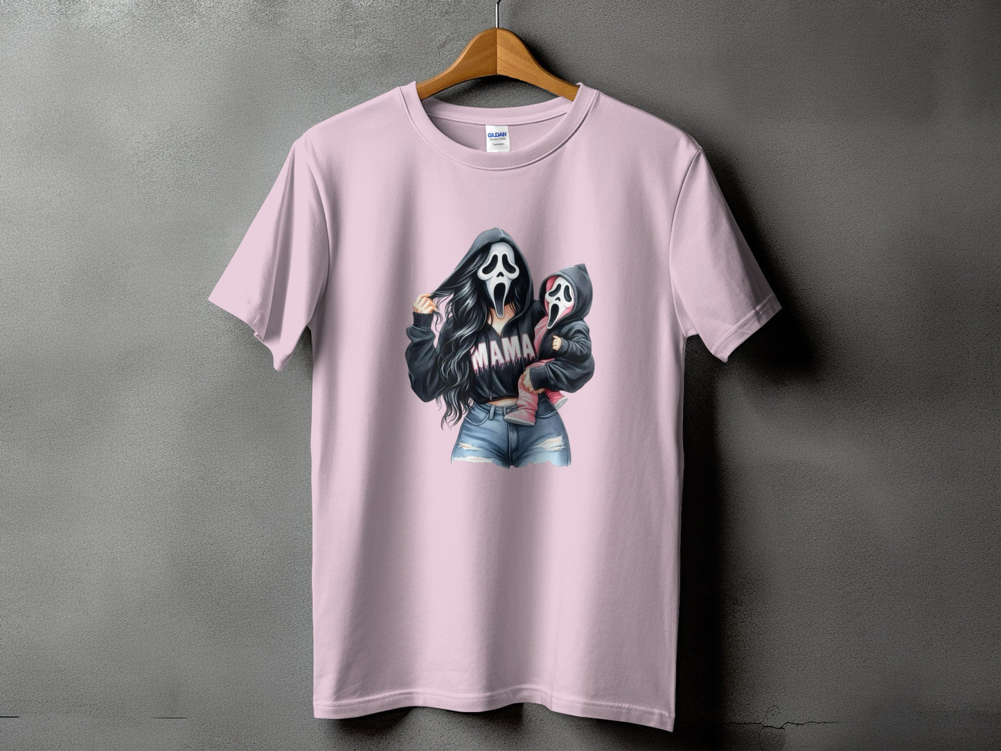 Pink t-shirt with "Mama" ghost mask graphic of woman holding baby.