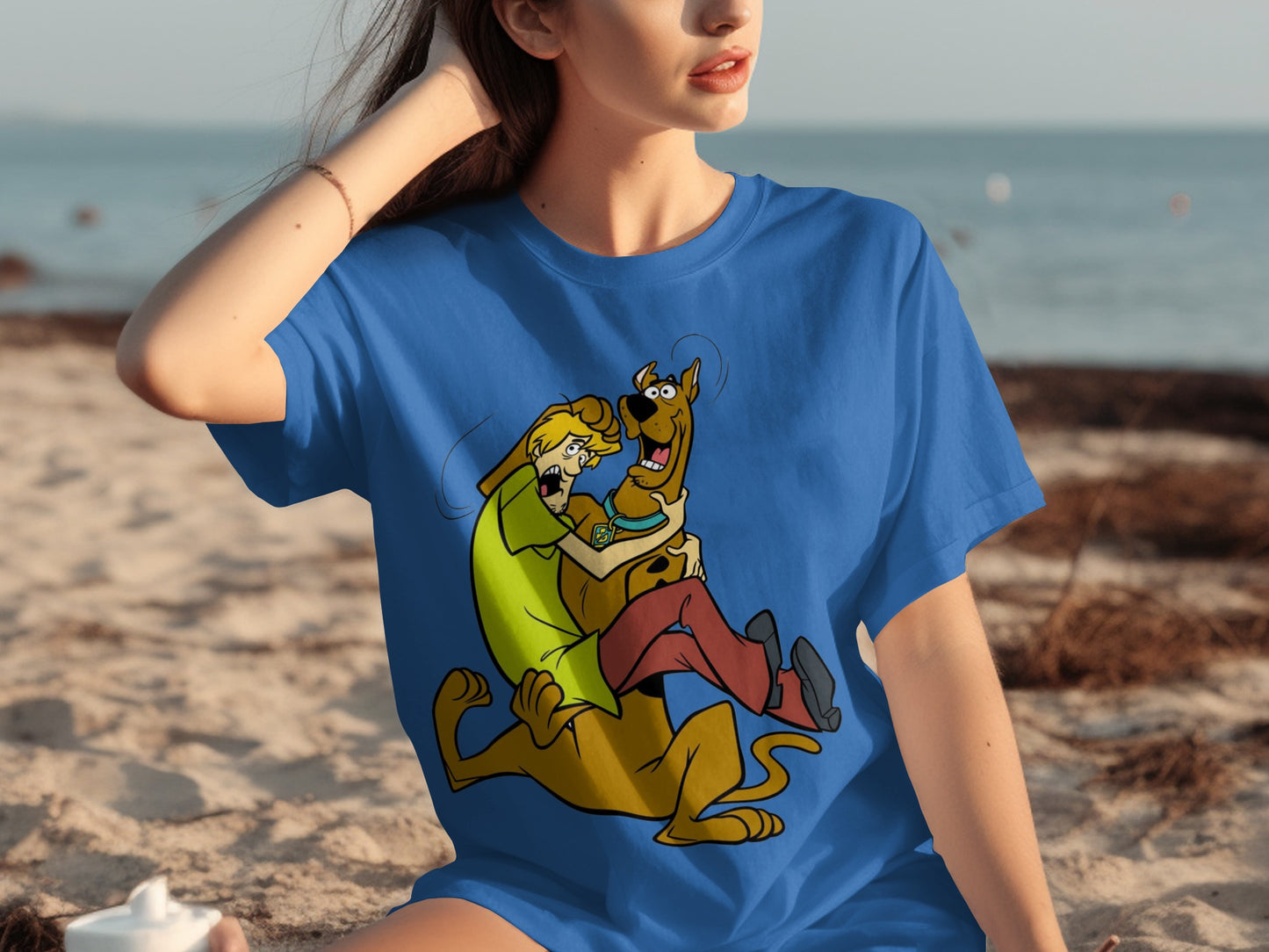 Blue Shirt with Cartoon Characters Relaxing on Beach
