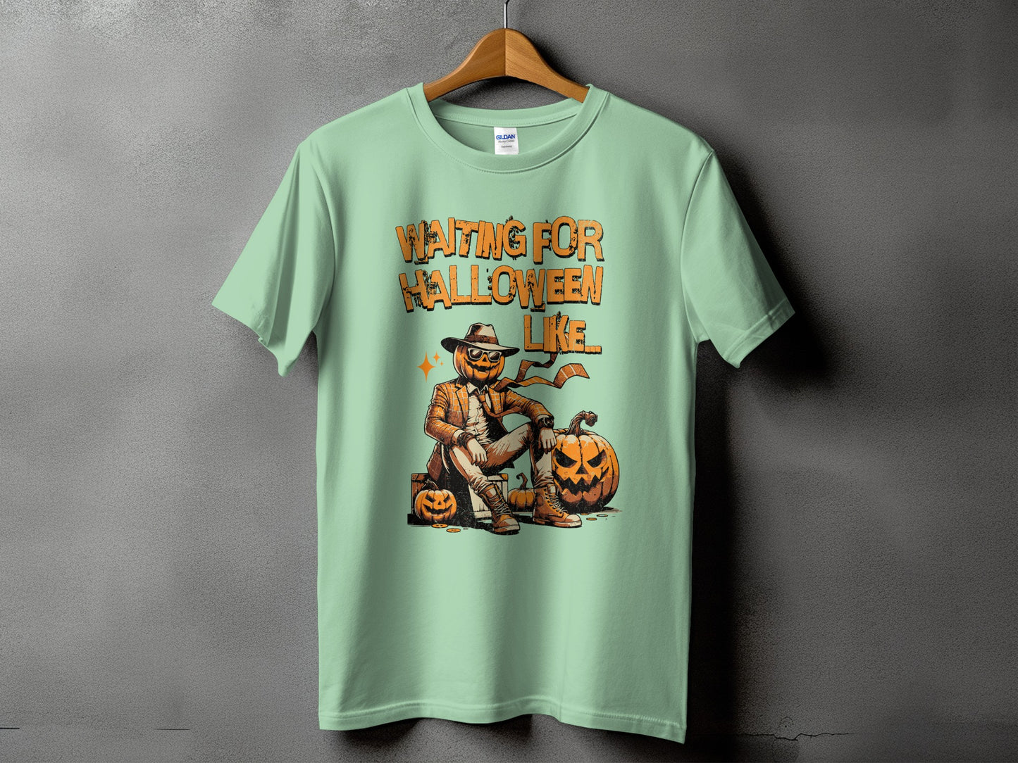 Light green t-shirt with "Waiting For Halloween Like" text and a jack-o'-lantern character.