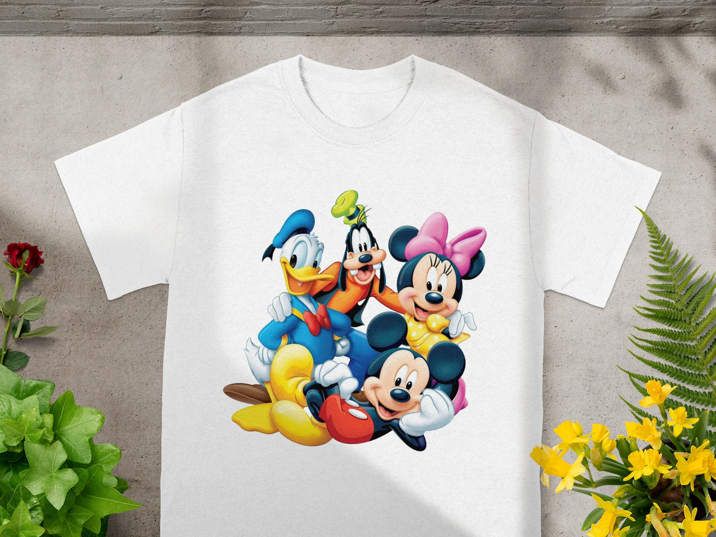 White t-shirt with Mickey, Minnie, Donald, and Goofy characters embracing.