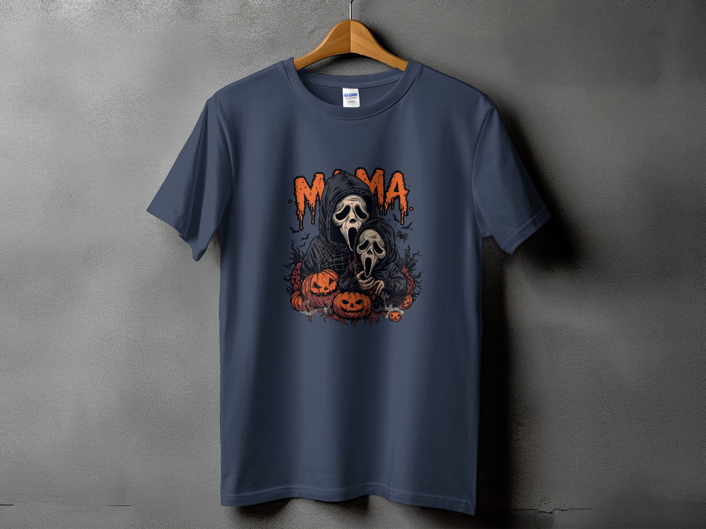 T-shirt with "Mama" text and scary ghost figures surrounded by pumpkins.