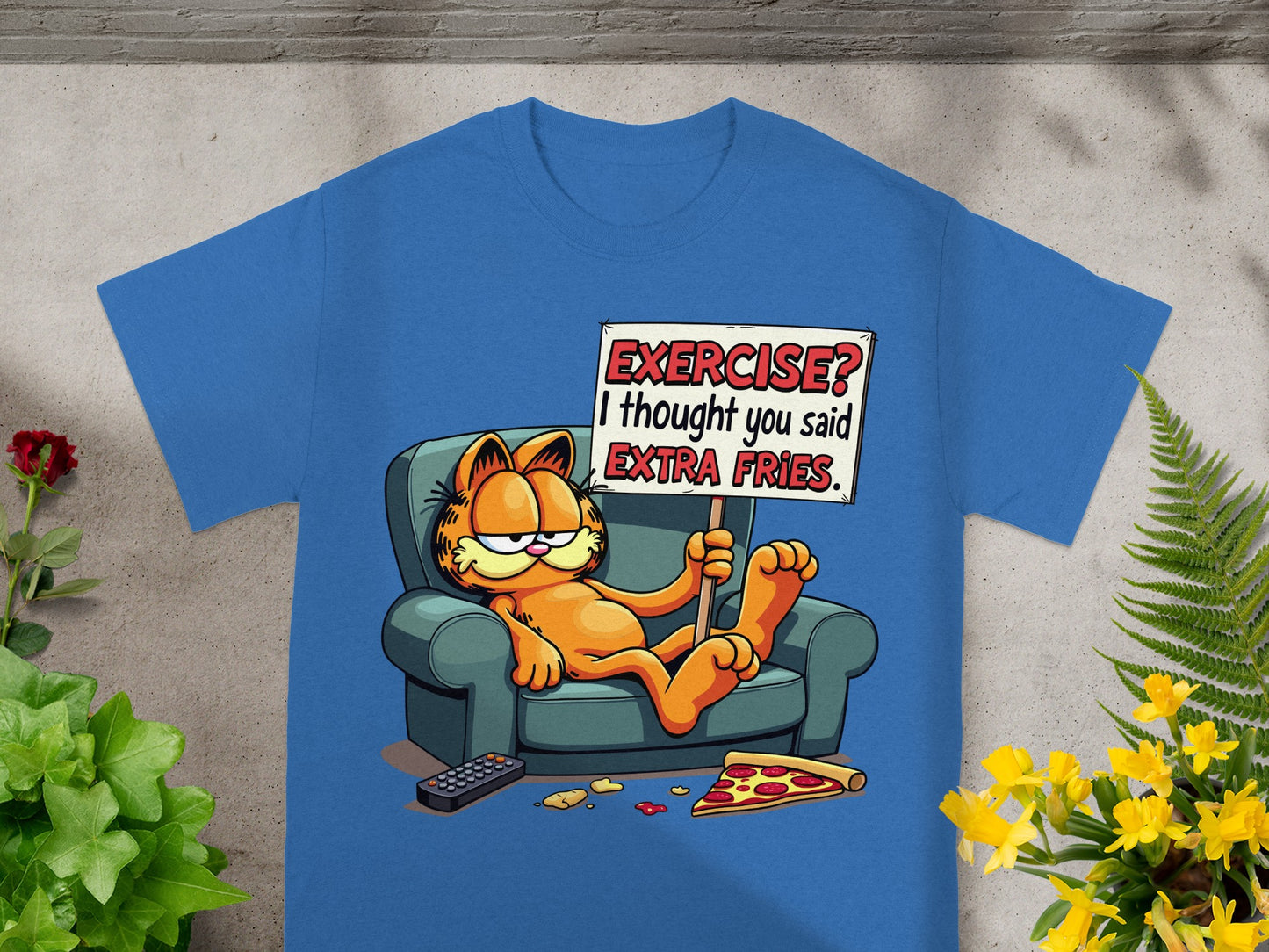 Garfield on a couch with a sign that says "EXERCISE? I THOUGHT YOU SAID EXTRA FRIES."