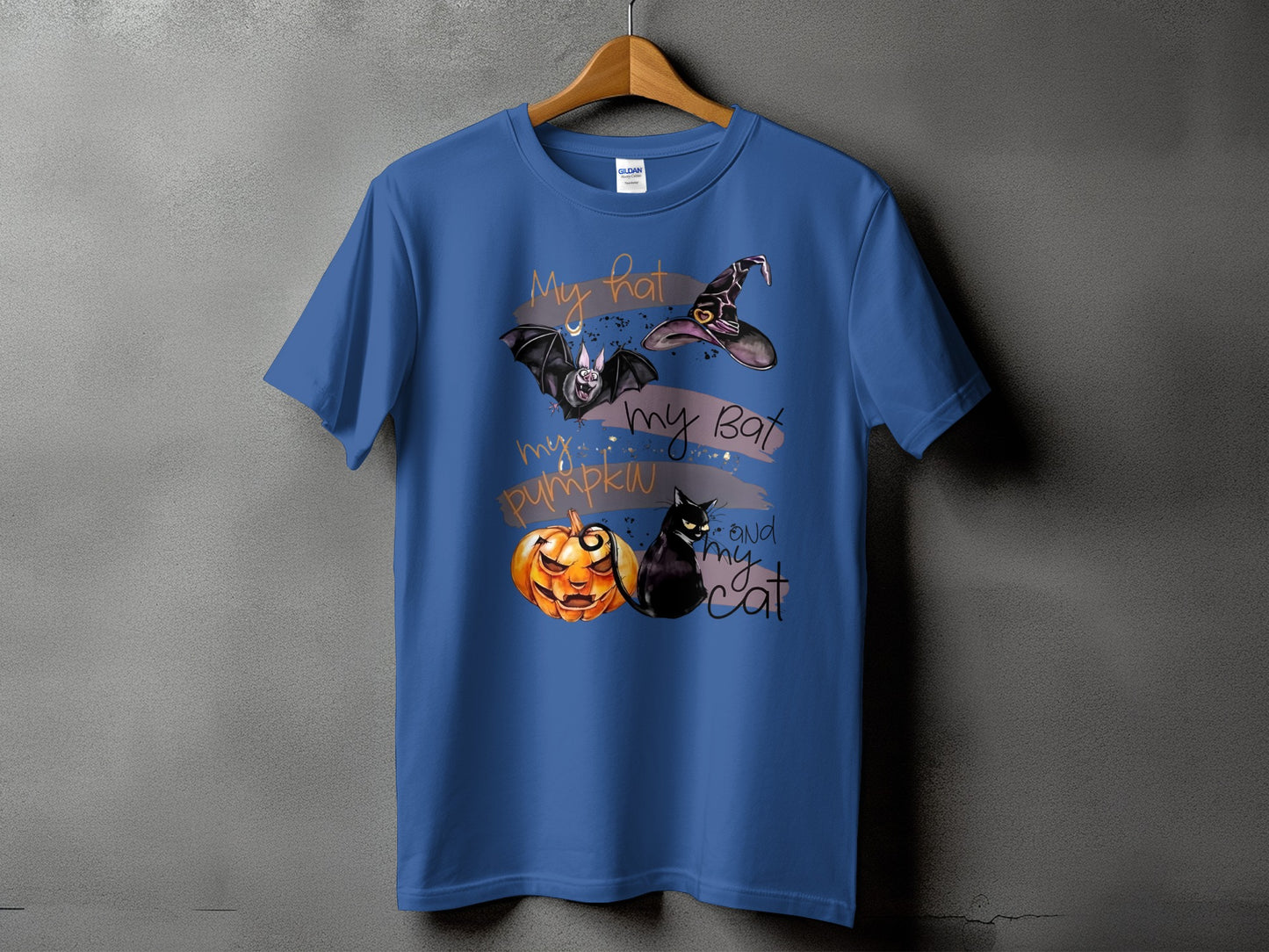 Blue t-shirt with Halloween graphic of a witch's hat, bat, pumpkin, and cat.