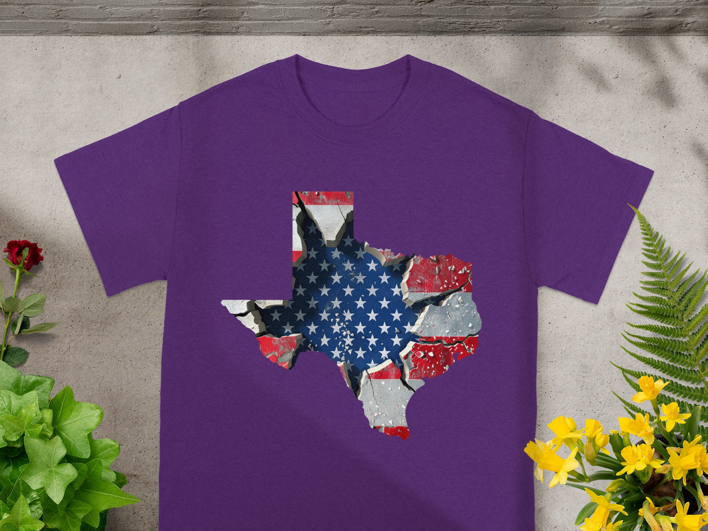 Purple t-shirt with a cracked American flag design shaped like Texas.