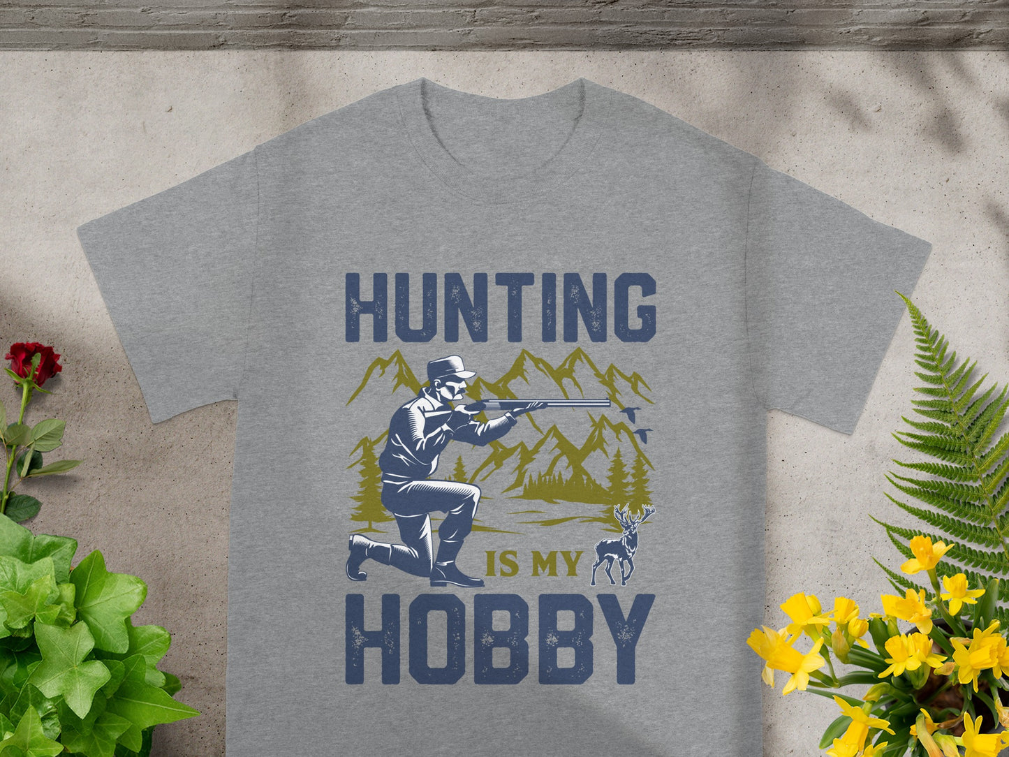 Grey t-shirt featuring "HUNTING IS MY HOBBY" text with hunter illustration.