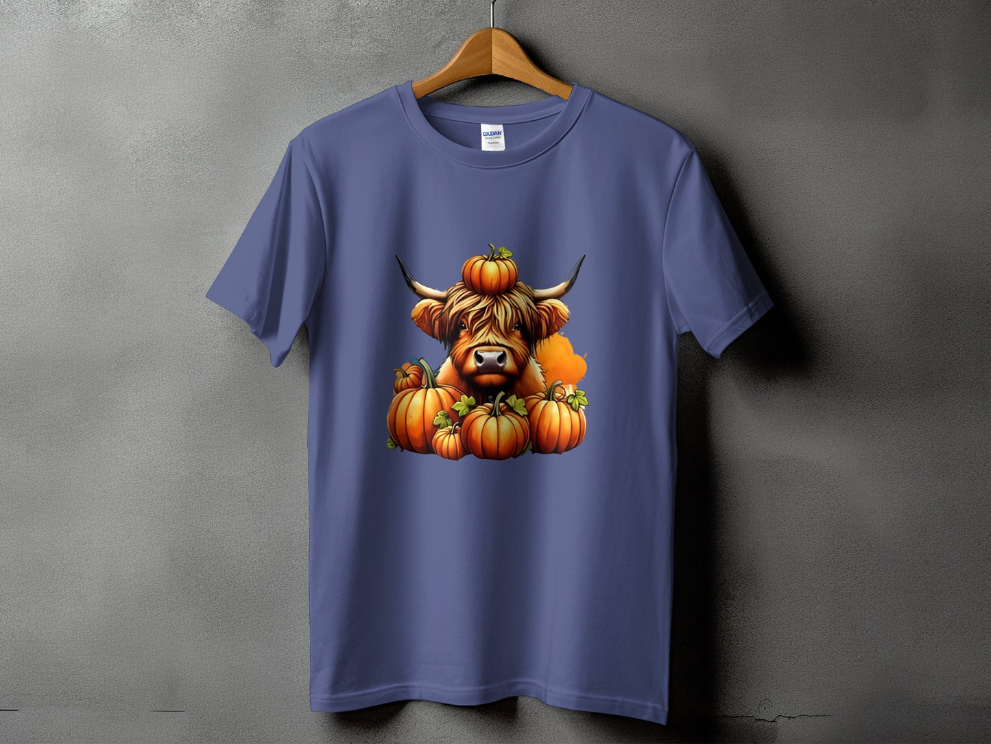 Highland cow with pumpkins on a purple t-shirt.
