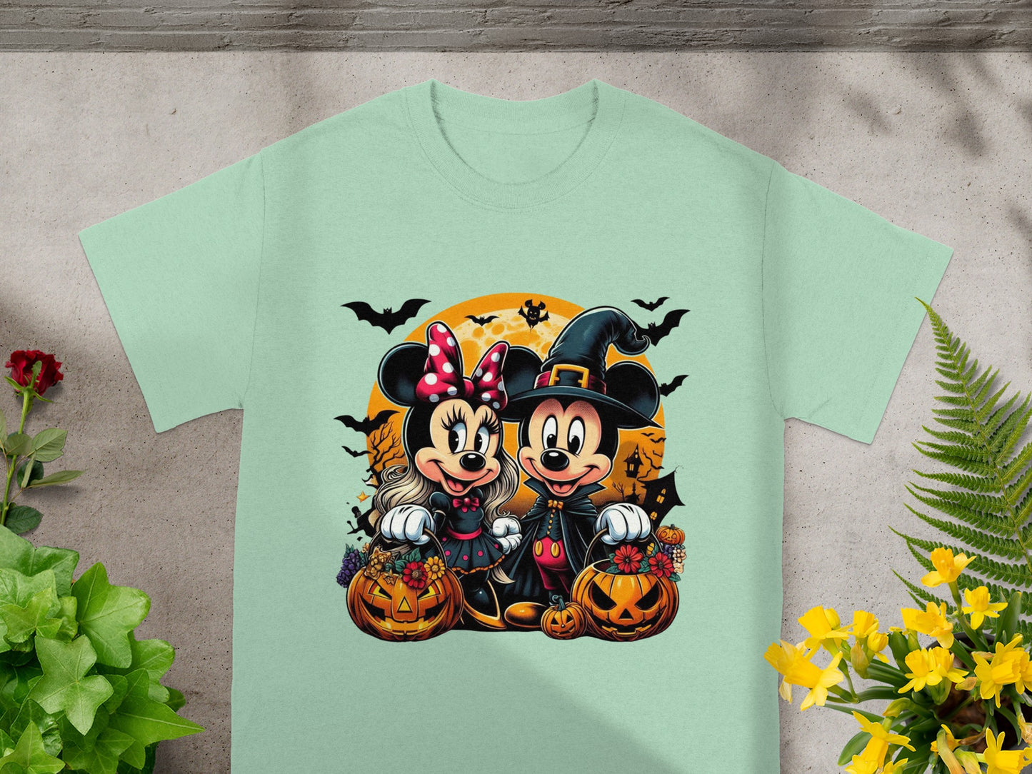 Minnie and Mickey Mouse in Halloween costumes with pumpkins, bats, and a spooky moon.