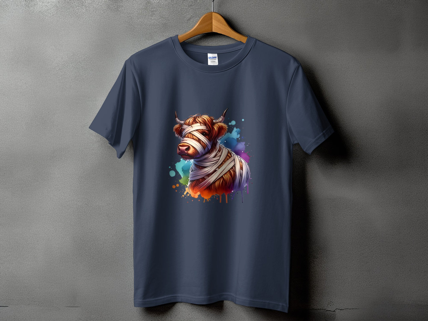 Watercolor Highland cow with mummy bandages on navy t-shirt.