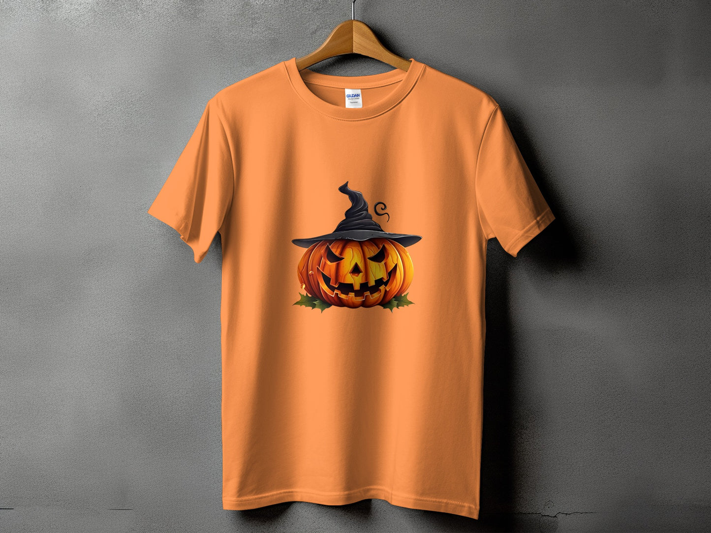 Orange t-shirt with a jack-o'-lantern wearing a witch hat graphic.
