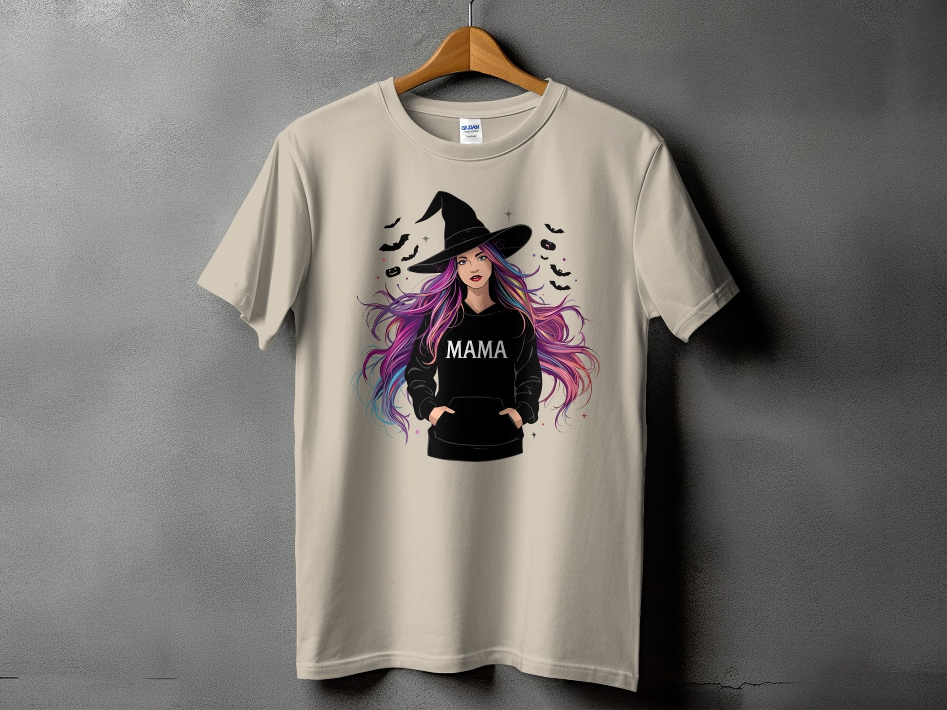 Light beige t-shirt with a witch graphic and "MAMA" text.