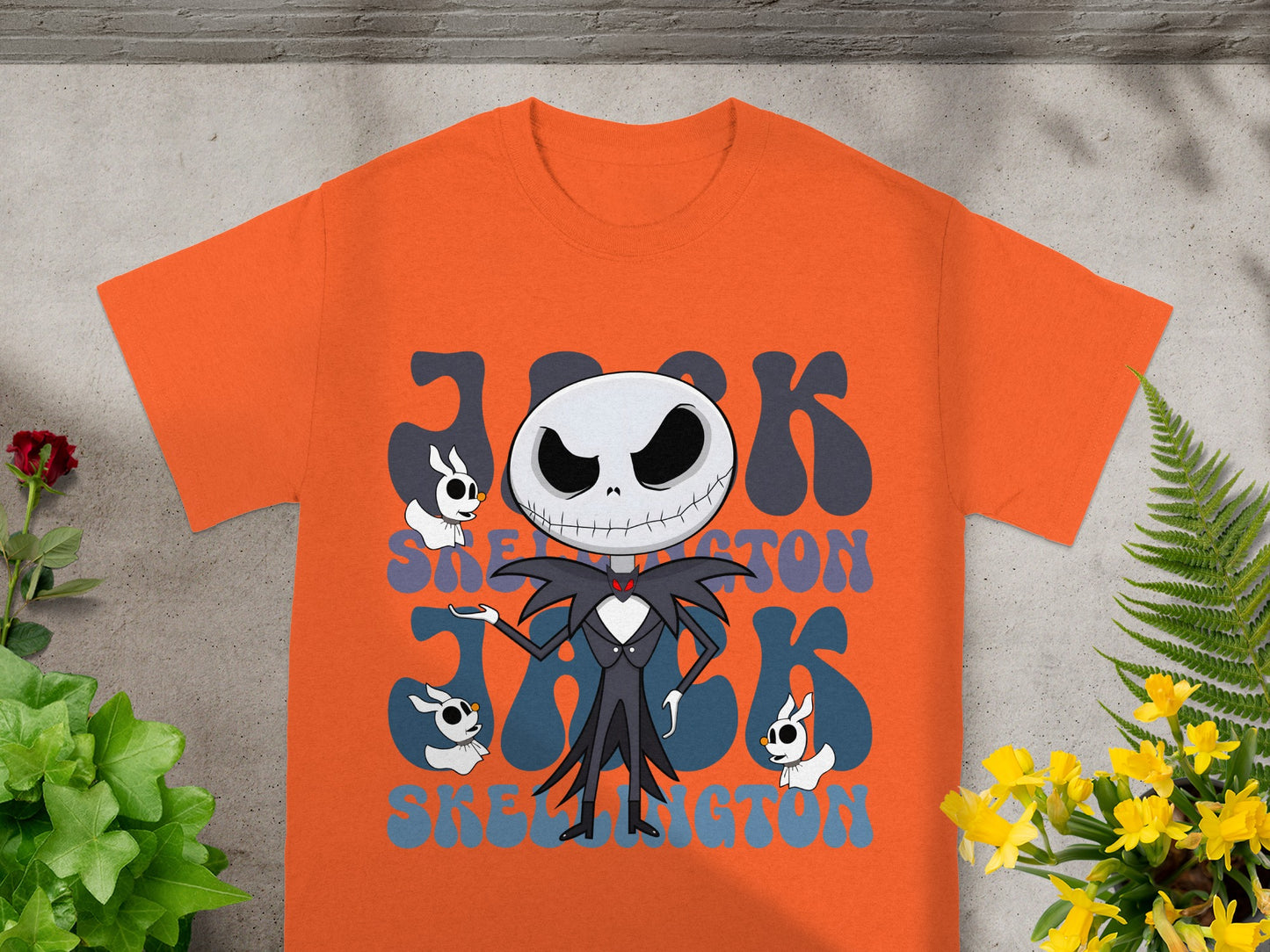 Orange t-shirt with Jack Skellington and spooky lettering.