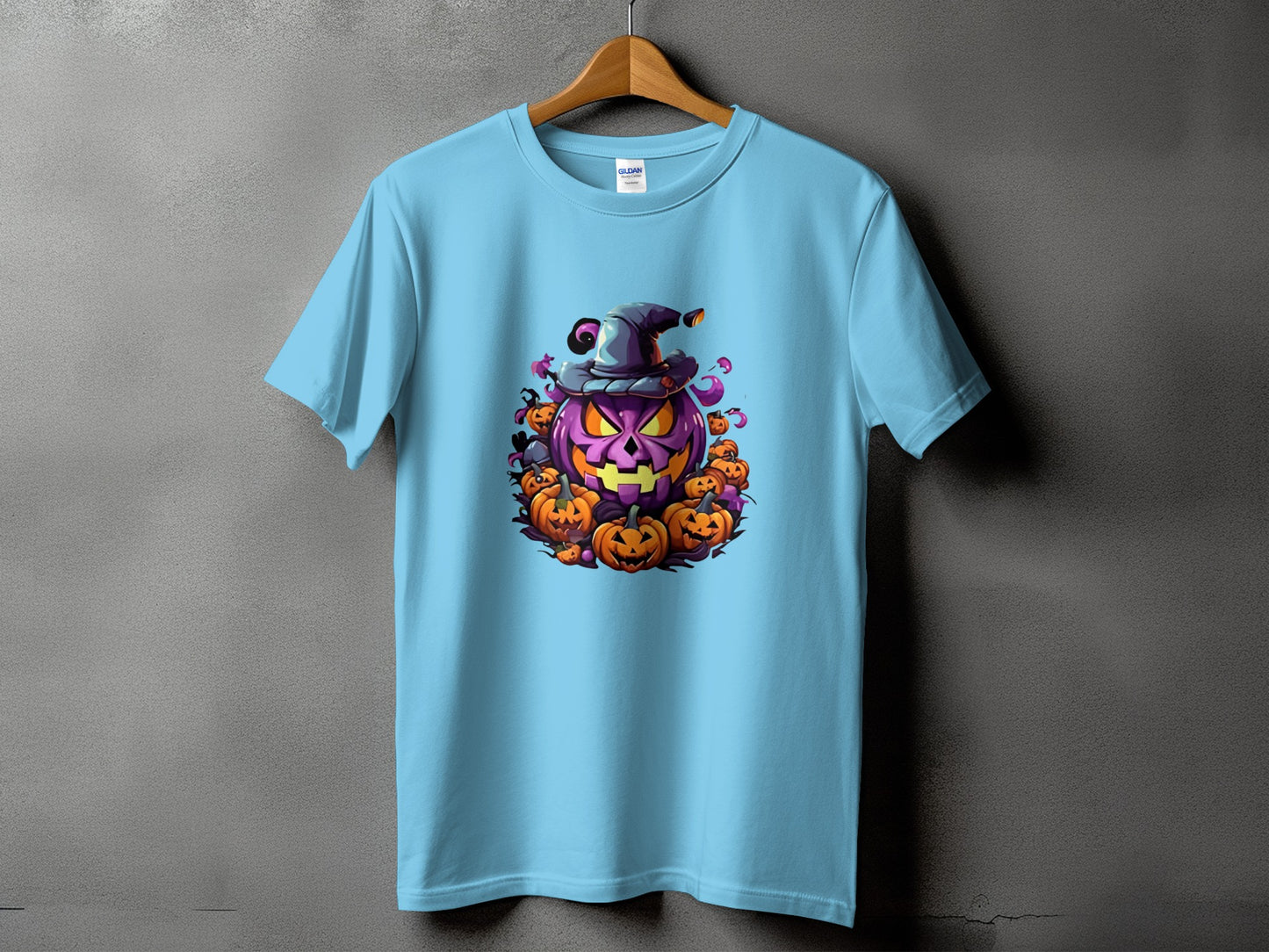 Light blue t-shirt with a Halloween jack-o'-lantern graphic wearing a witch hat.